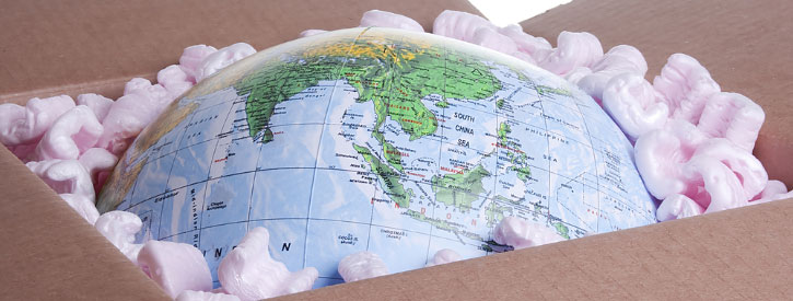 a globe inside a cardboard box, representing idaho international movers