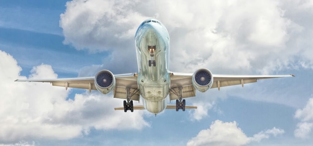A plane mid flight during the day