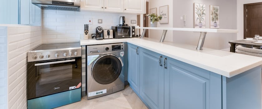 A Modern Kitchen Interior with a washer and a dryer.