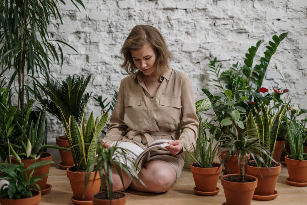 A woman who will carefully prepare plants for relocation.