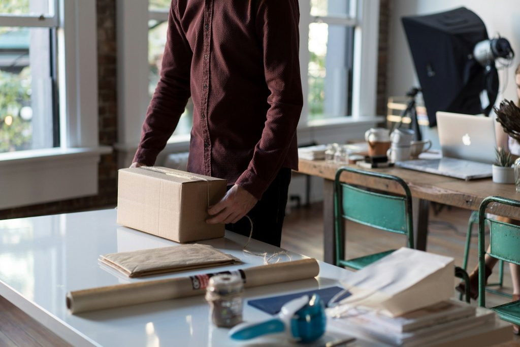 A man packing his business for a move