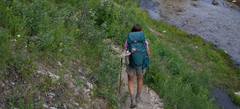 A person hiking along a trail in the mountains of Idaho