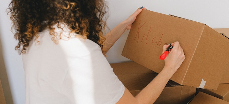 woman labeling boxes
